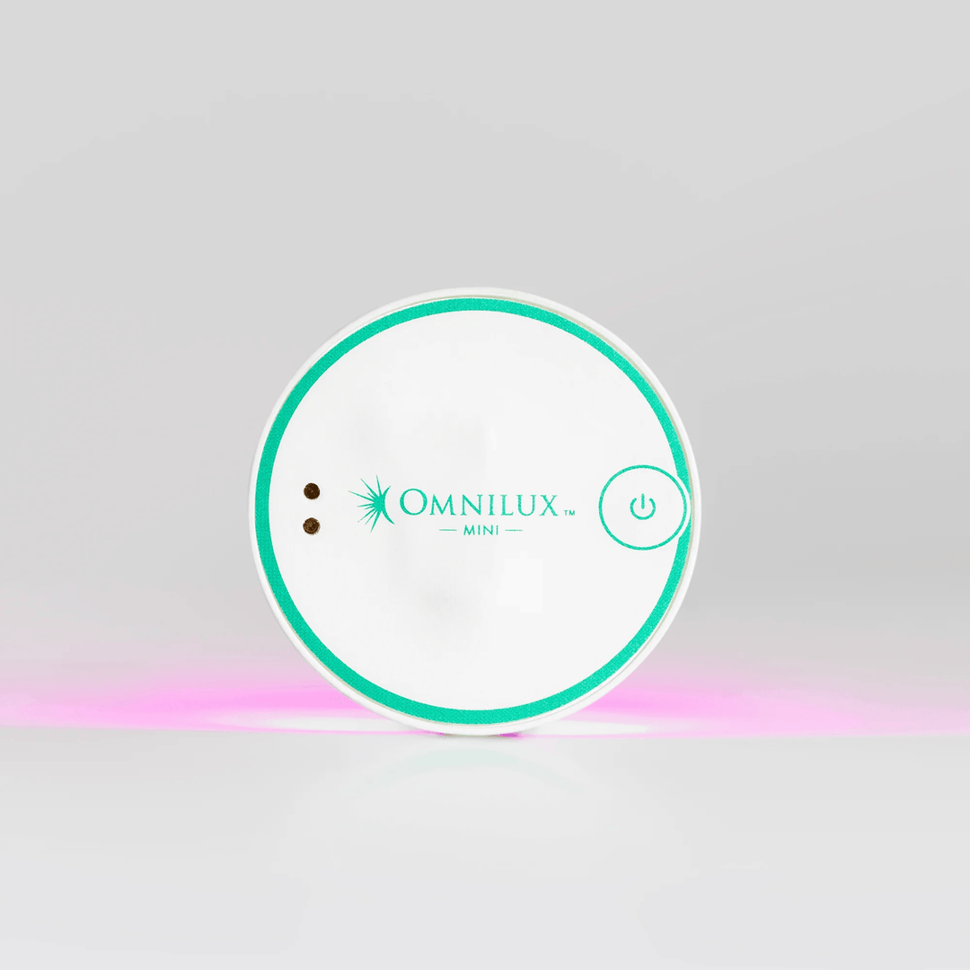 Omnilux Mini device packaging on a gray background